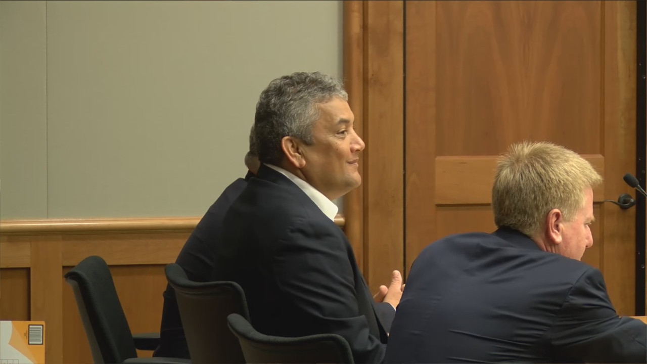 Mayor Billy Kenoi smiles in Hilo court before the opening statements are presented.