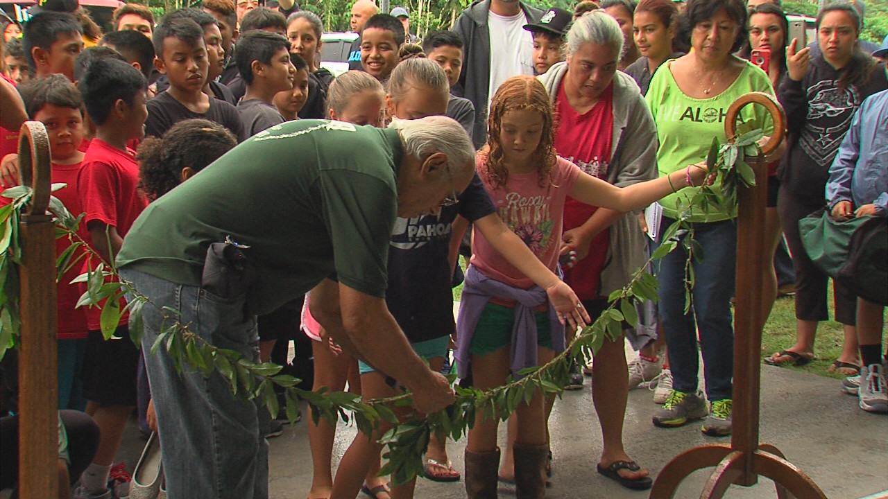 The maile lei is united just outside the new covered play courts within the Pahoa District Park.
