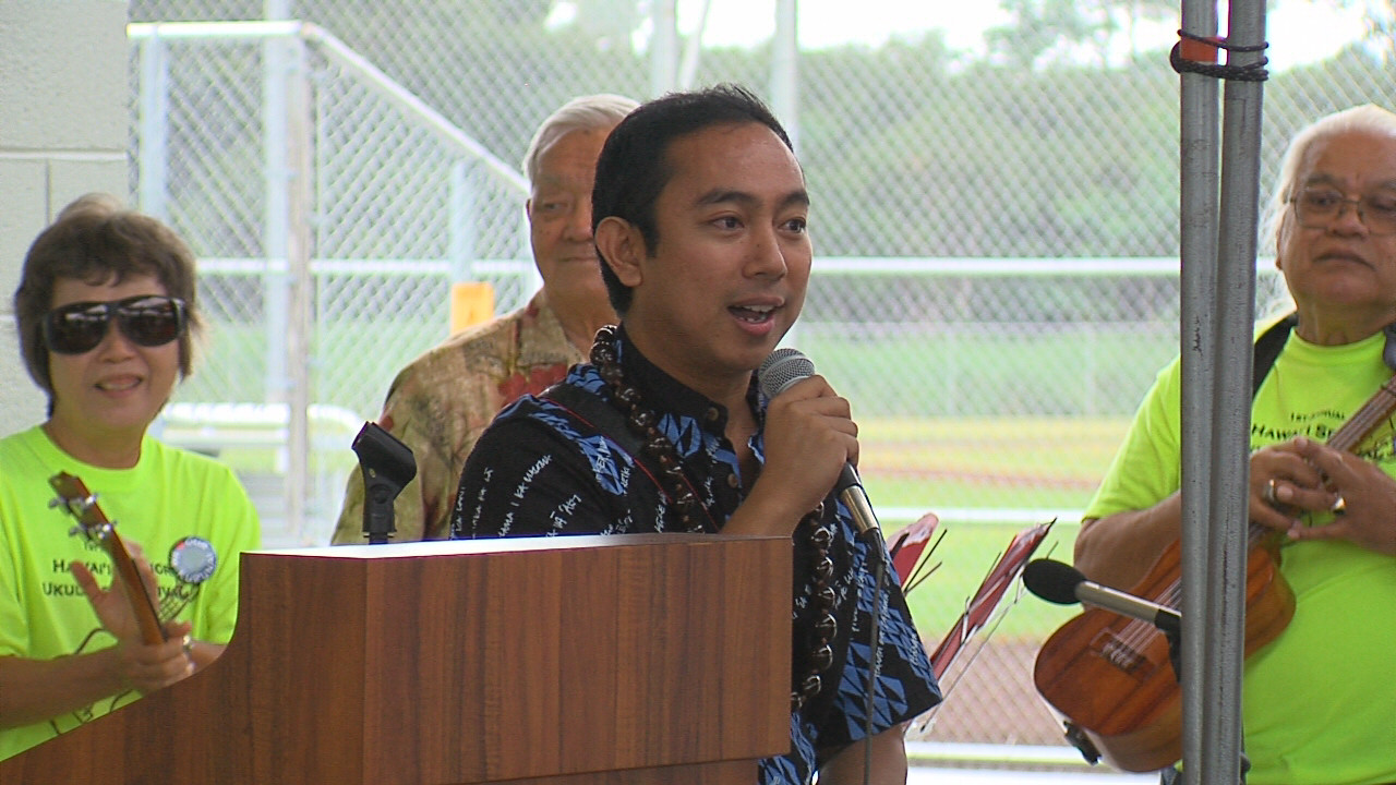 An enthusiastic Greggor Ilagan takes the mic during the Pahoa District Park grand opening.