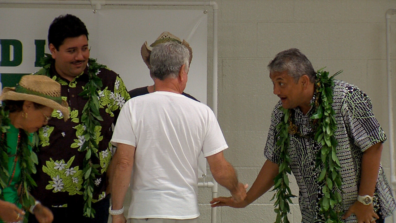 Kenoi greets fellow Democrats following his short speech on Monday evening.